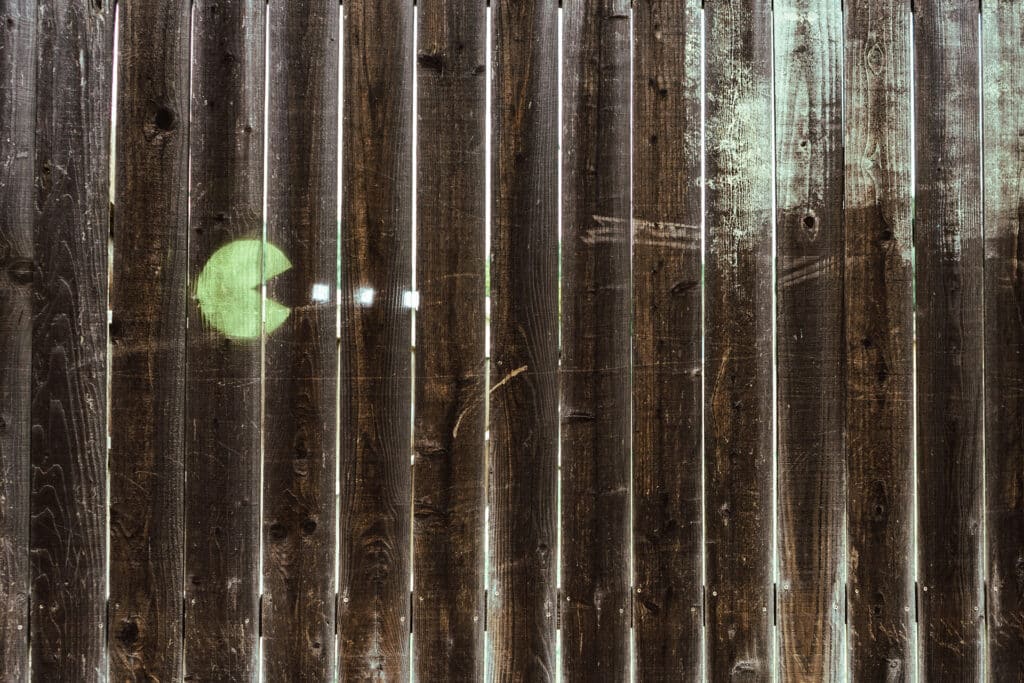 PAC-Man on wooden wall graffiti