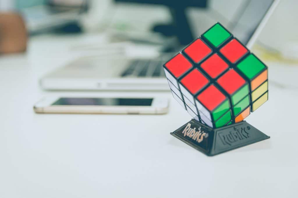 Rubik's cube next to smartphone